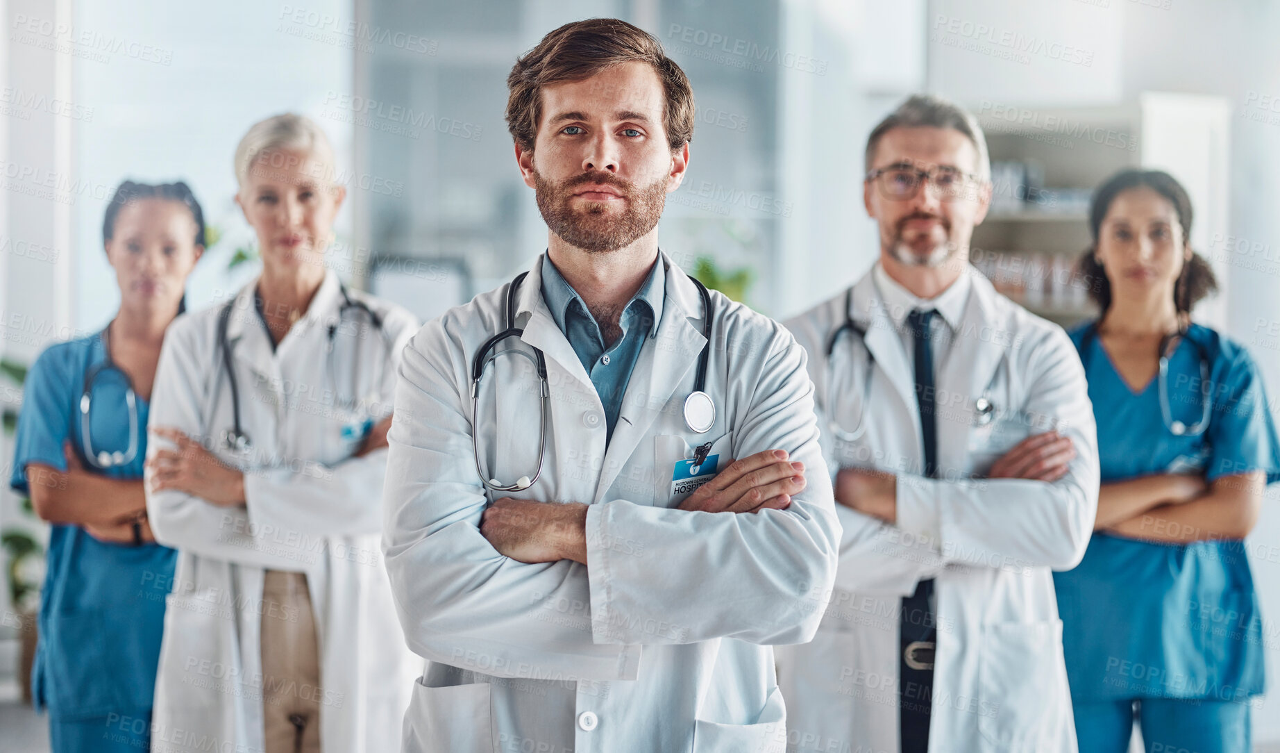 Buy stock photo Teamwork, leadership and portrait of doctor with team in hospital with support, success and help in medical work. Health, wellness and medicine, confident doctors and nurses or healthcare employees.