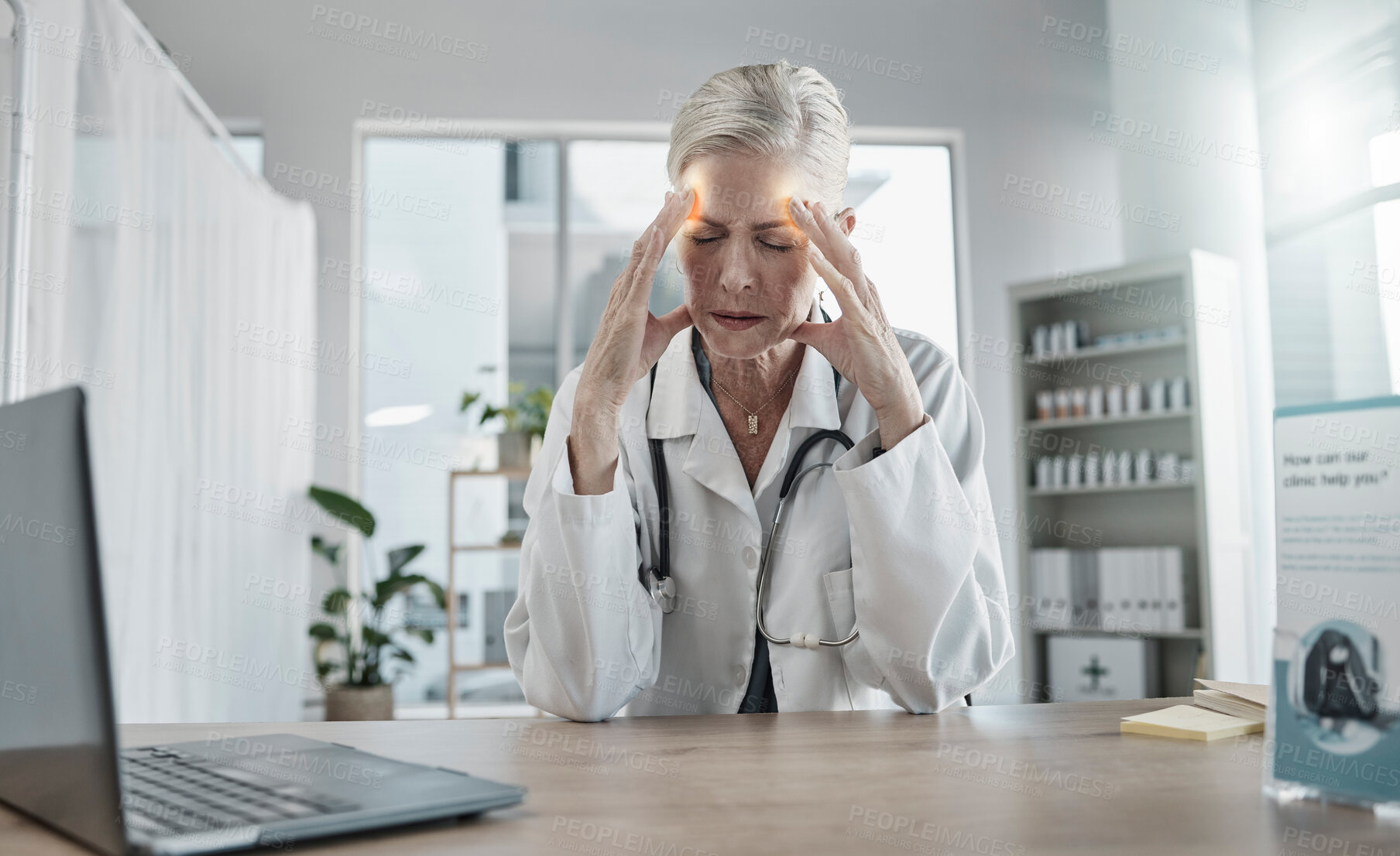 Buy stock photo Headache, stress and female doctor in her office with a laptop in the hospital after a consultation. Frustrated, burnout and senior woman healthcare worker working with a migraine in a medical clinic