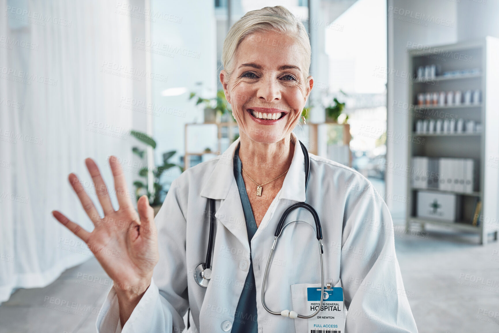 Buy stock photo Video call, smile and wave, portrait of woman doctor in hospital office, communication and success in medical work. Health, medicine and face of confident mature professional and online consultation.