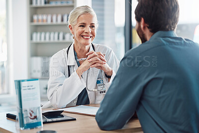 Consultation, doctor and patient talking with woman in hospital for doctors appointment. Healthcare, wellness and man consulting happy senior medical professional for health advice or help in clinic.