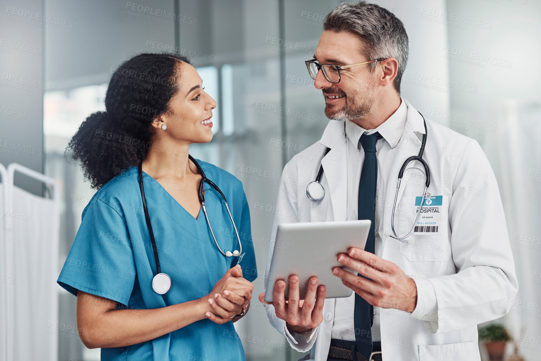 Buy stock photo Tablet, collaboration and team of doctors in a hospital analyzing results or diagnosis of patient. Teamwork, medical and healthcare workers in discussion and research on mobile device in a clinic.