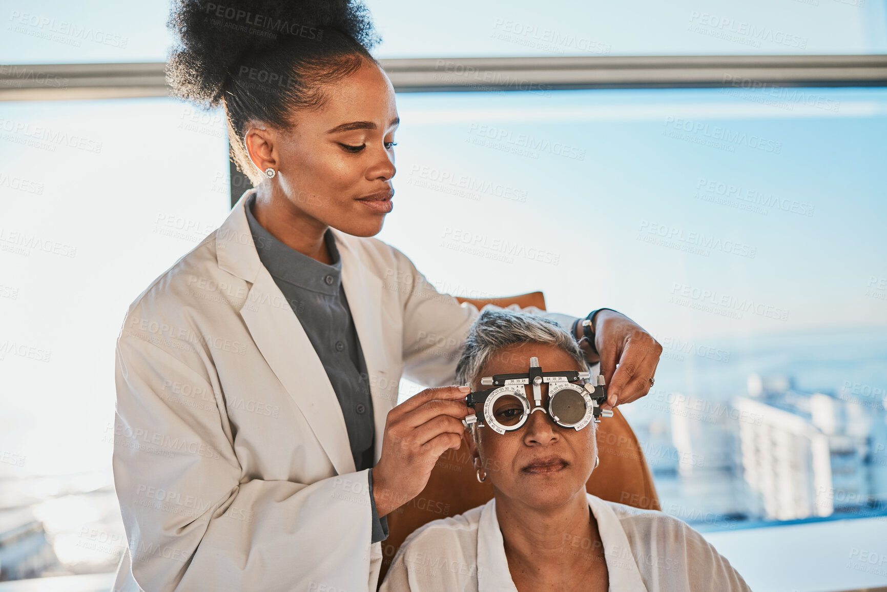 Buy stock photo Senior black woman, eye exam and medical test of elderly client at doctor consultation. Vision, healthcare focus and old female patient with consulting wellness expert for lens and glasses check