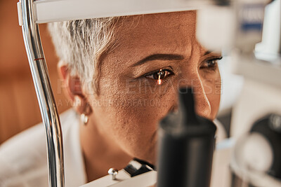 Buy stock photo Laser, vision or senior customer in eye exam for eyesight at optometrist office in assessment or consultation. Face of mature woman testing or checking vision to help iris or retina visual health 