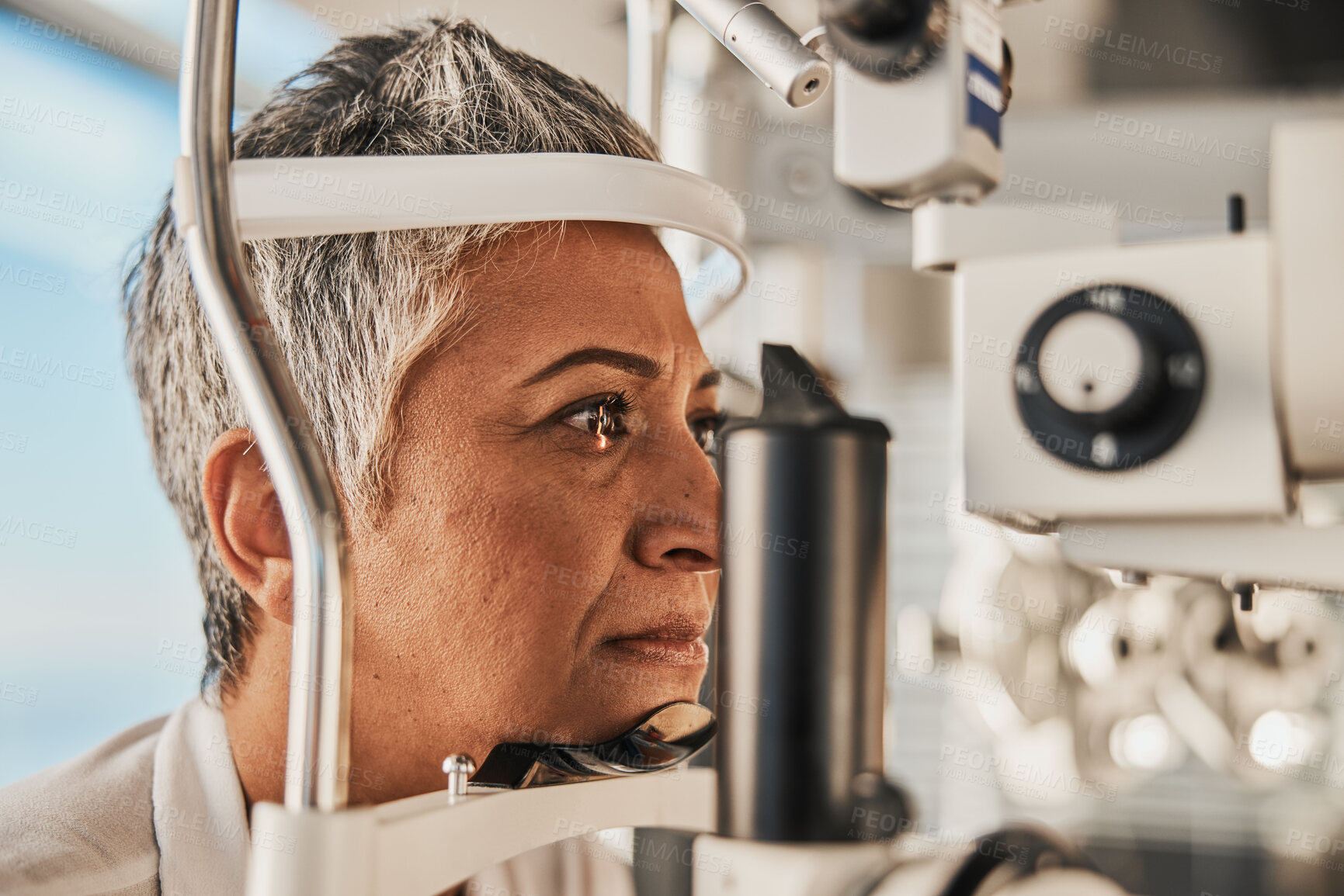 Buy stock photo Optometry, slit lamp and eye exam by senior woman or patient with medical insurance using machine. Ophthalmology, eyesight and female test vision in clinic as eyecare during consultation