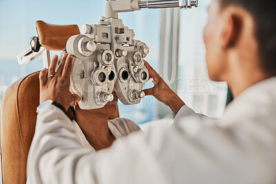 Buy stock photo Senior optometry woman, eye exam patient and medical goal in hospital, consultation room and office with help. Elderly optician, eyesight test and phoropter for wellness, health and vision analysis