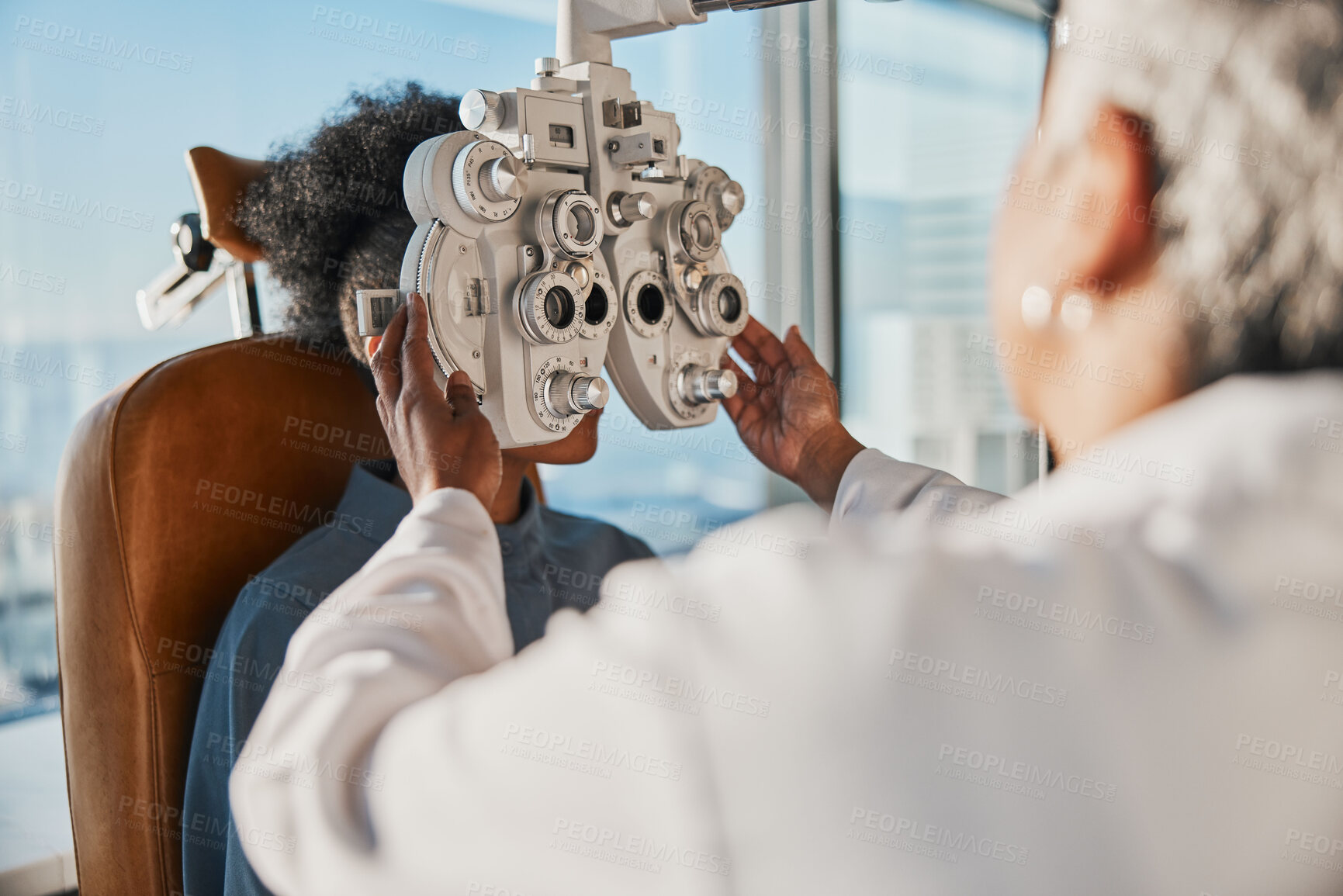 Buy stock photo Optometry, healthcare and optometrist doing a eye test for a patient for vision or eyecare in a clinic. Ophthalmology, medical and female optician doing exam for prescription lenses in optical store.