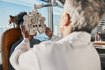 Buy stock photo Optometry, eyecare and optician doing a eye test for a patient for vision or healthcare in a clinic. Ophthalmology, medical and female optometrist doing exam for prescription lenses in optical store.