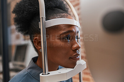 Buy stock photo Optometry, healthcare and woman doing eye test at a clinic for optic wellness, health and vision. Medical, ophthalmology and African female patient doing optical exam for prescription lenses in store