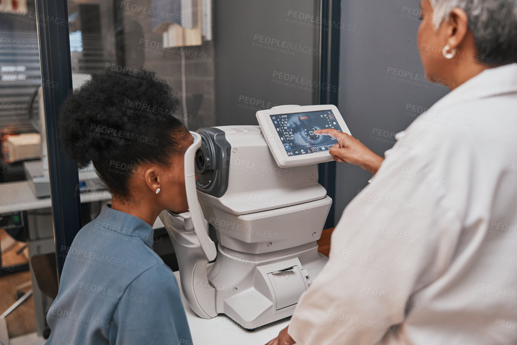 Buy stock photo Digital eye test, vision and health for eyes, optometry and doctor with patient, eyecare and ophthalmology clinic. Machine, screen and black woman with senior optometrist, service and medical exam