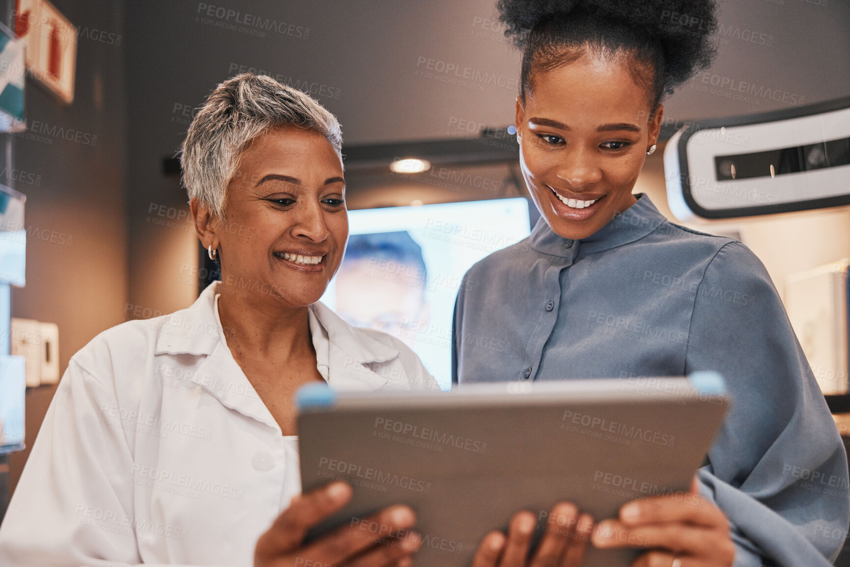 Buy stock photo Tablet, optometry and optometrist talking to a patient about eye test results or consultation. Vision, technology and senior optician speaking to a black woman with a touchscreen at an optical clinic