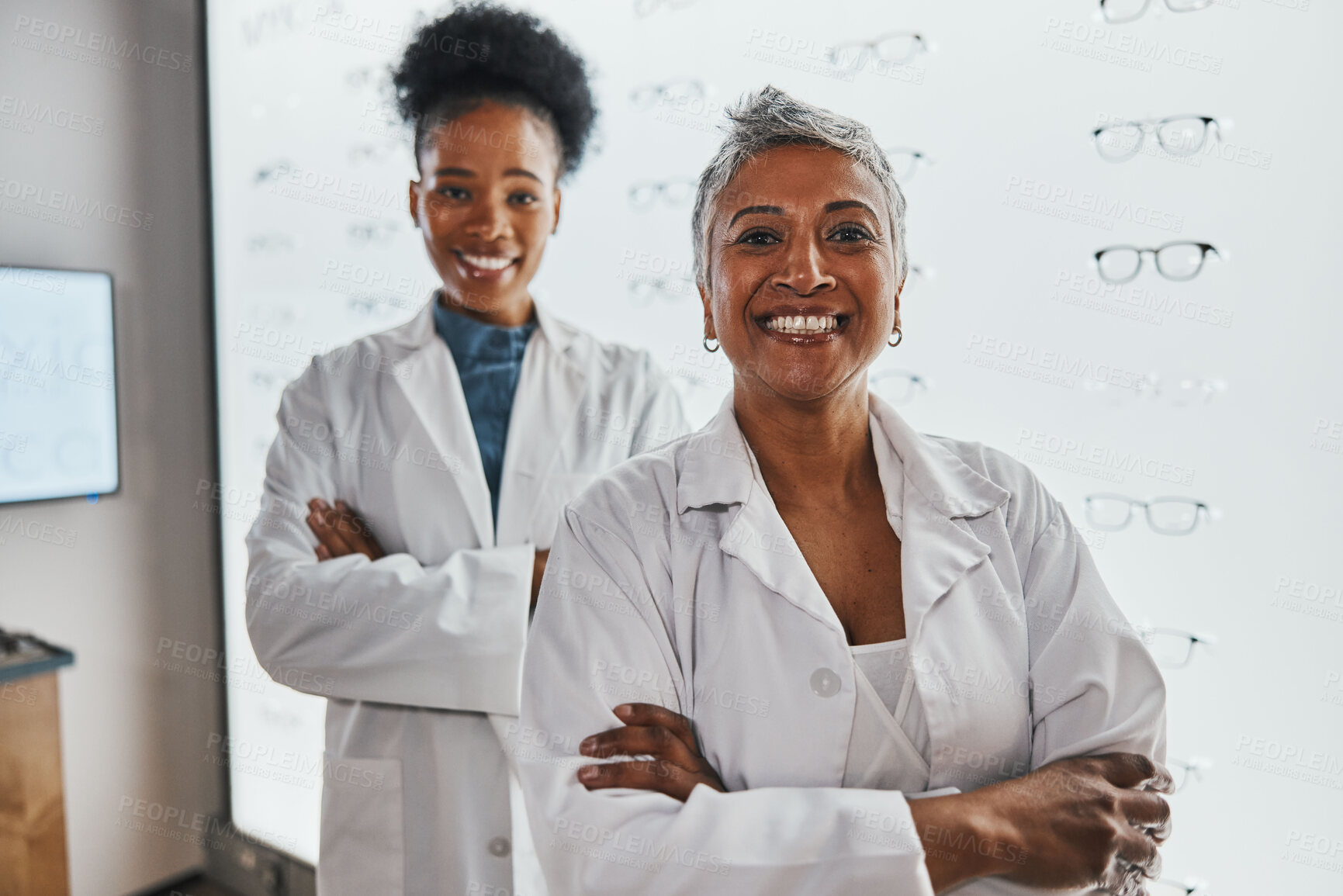 Buy stock photo Portrait, optometrist teamwork and smile of women in shop or store for glasses, eyewear or eye care spectacles. Ophthalmology, vision and happy, proud or confident senior optician with black woman.