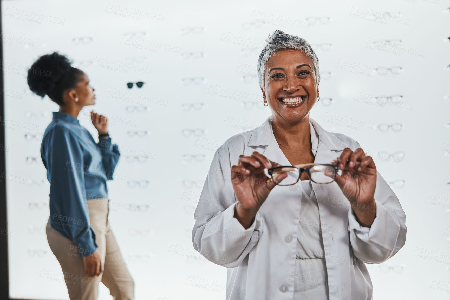 Buy stock photo Portrait, woman and smile of optician with glasses in shop or store for frames, eyewear or eye care spectacles. Ophthalmology, vision and happy, proud or confident senior female medical optometrist.