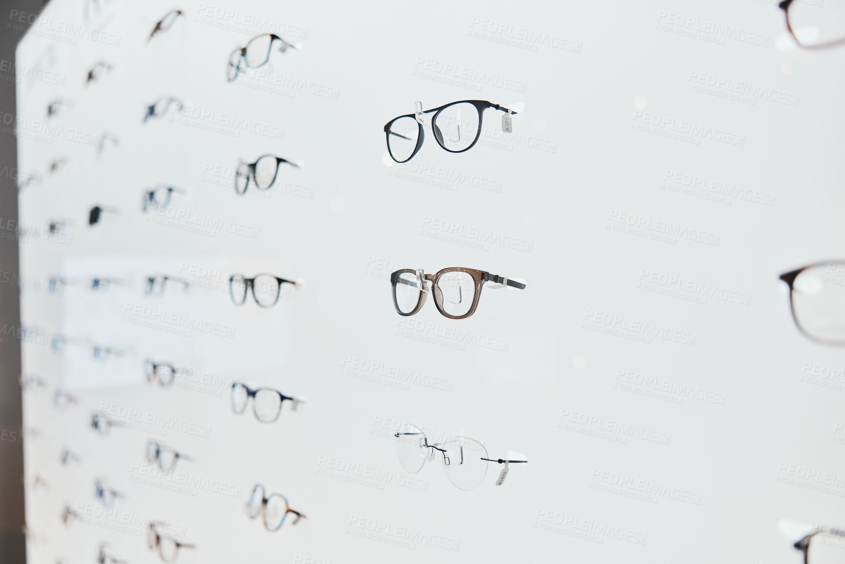 Buy stock photo Glasses, frame choice and retail sale in a healthcare, eye wellness and wellness store with no people. Shop stock, eyewear and consumer products on a display stand for shopping and buying in market