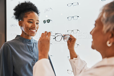 Buy stock photo Vision, optician and black woman shopping for glasses in optometry store or shop for ophthalmology. Doctor, healthcare and happy female or medical ophthalmologist with eyewear or lenses for eye care.