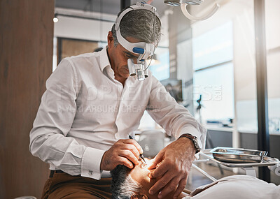 Buy stock photo Healthcare, optometry and optometrist doing a cataract surgery on a senior patient in the clinic. Medical, eye care and male optician doing ophthalmology procedure for elderly woman at optical office