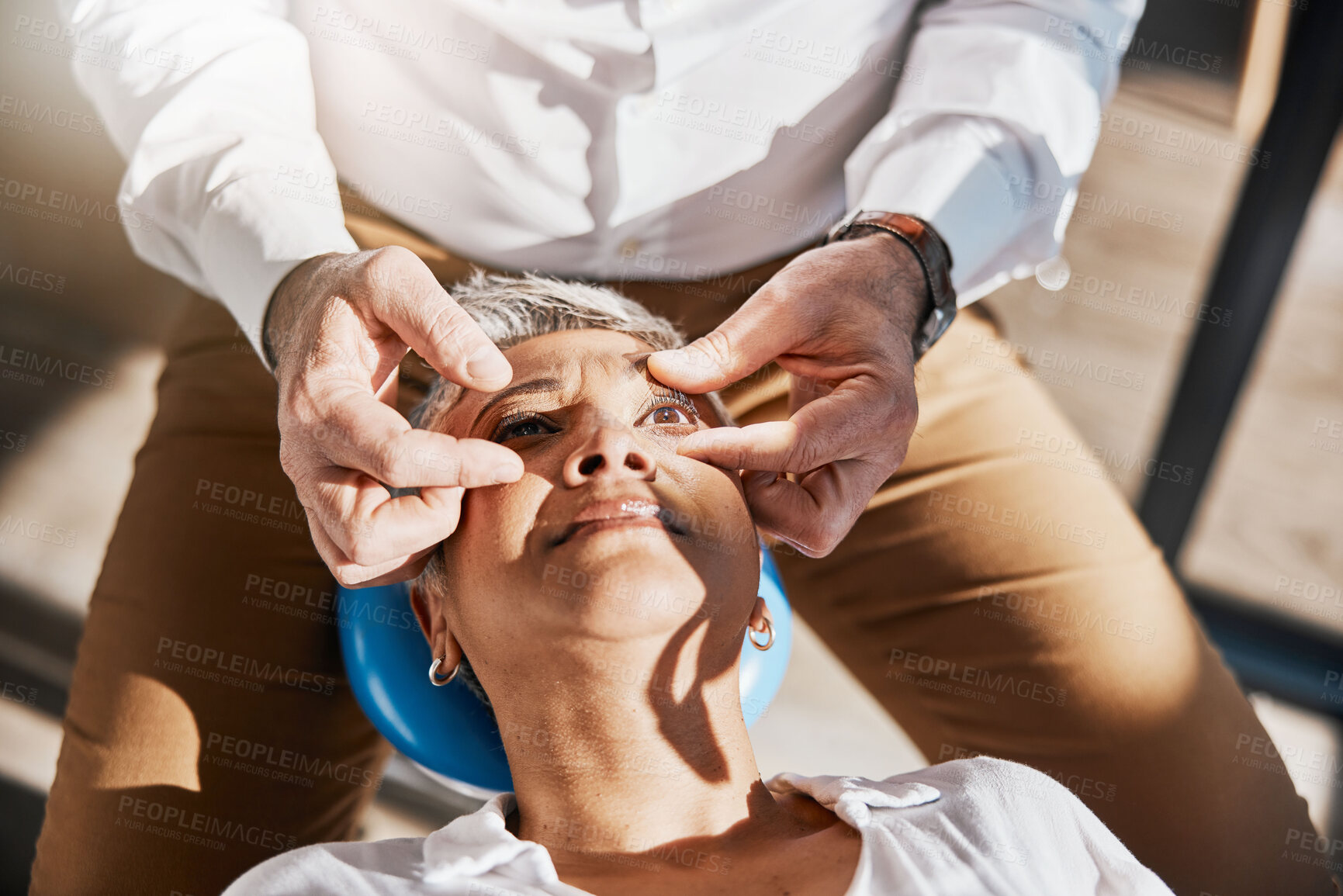 Buy stock photo Hands, face or senior woman in eye exam for eyesight at optometrist for an assessment in office. Doctor or optician helping a mature customer testing or checking vision, iris or retina visual health 