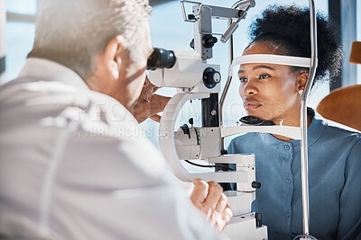 Buy stock photo Help, eye exam or black woman consulting doctor for eyesight at optometrist or ophthalmologist. African customer testing vision with mature optician checking iris, glaucoma or retina visual health