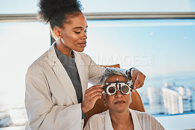 Buy stock photo Senior eye exam, black woman doctor and medical eyes test of elderly female at consultation. Vision, healthcare focus and old patient with consulting wellness expert for lens and glasses check