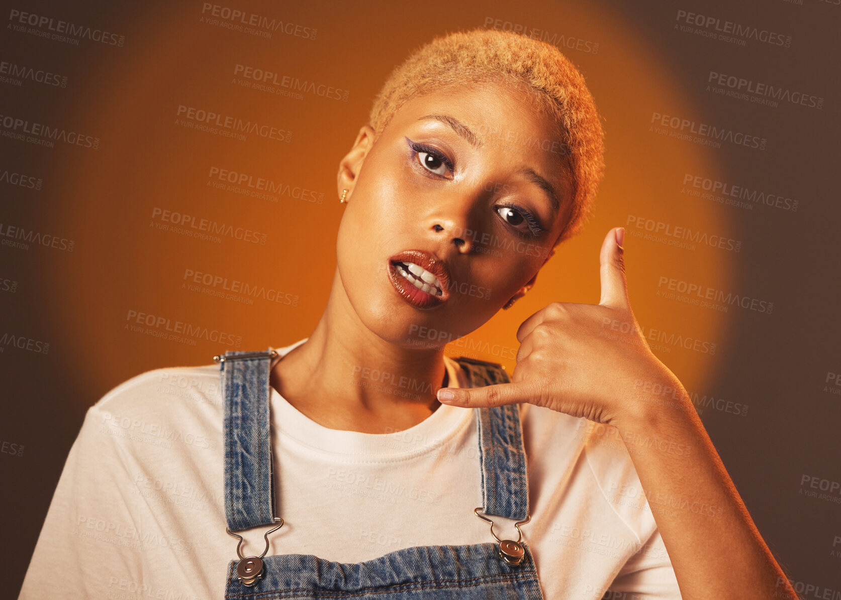 Buy stock photo Black woman, portrait and call me hand sign, emoji or gesture for marketing against a studio background. African American female face looking and showing hang loose or contact advertising on mockup