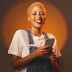 Portrait of black woman, smile and phone, typing message or email and browsing social media isolated in studio. Internet, connection and gen z fashion, happy influencer girl with smartphone in hands.