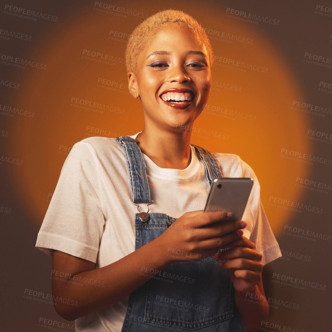 Buy stock photo Portrait of black woman, smile and phone, typing message or email and browsing social media isolated in studio. Internet, connection and gen z fashion, happy influencer girl with smartphone in hands.
