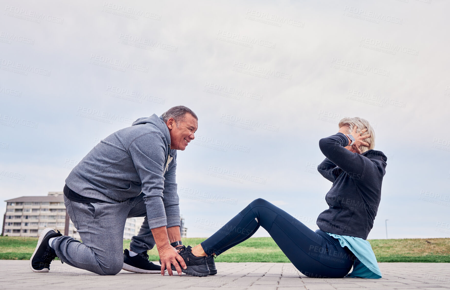 Buy stock photo Fitness, health and sit ups with a senior couple training outdoor together for an active lifestyle of training. Workout, exercise or core with a mature man and woman outside on the promenade