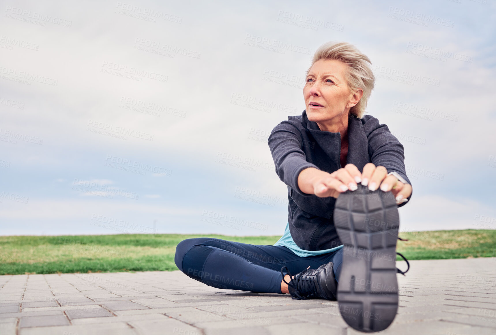 Buy stock photo Woman, stretching exercise and fitness on blue sky mockup, park ground and training for cardio wellness. Senior female warm up legs outdoor for workout, sports running and thinking of healthy body 