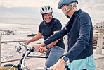 Bike, cycling and beach with a senior couple riding outdoor on the promenade during summer for exercise. Bicycle, fitness or leisure with a mature man and woman taking a ride together on their bikes