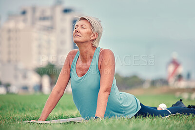 Buy stock photo Cobra stretching, senior woman and yoga on grass for workout, training and fitness. Elderly lady, pilates exercise and flexible body outdoor on mat, nature and wellness, healthy lifestyle and push up