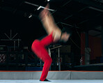 Moving, gymnastics and jump with man in stadium for sports, speed and motion blur. Workout, action and challenge with flexible athlete training in gym arena for performance, exercise and health