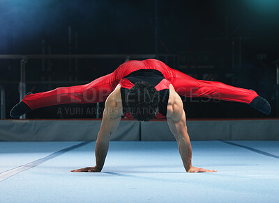 Buy stock photo Gymnastics, handstand and man on gym floor for training, balance and wellness with muscle, strong body and night. Gymnast, athlete and exercise in studio for competition, goals and fitness for sport