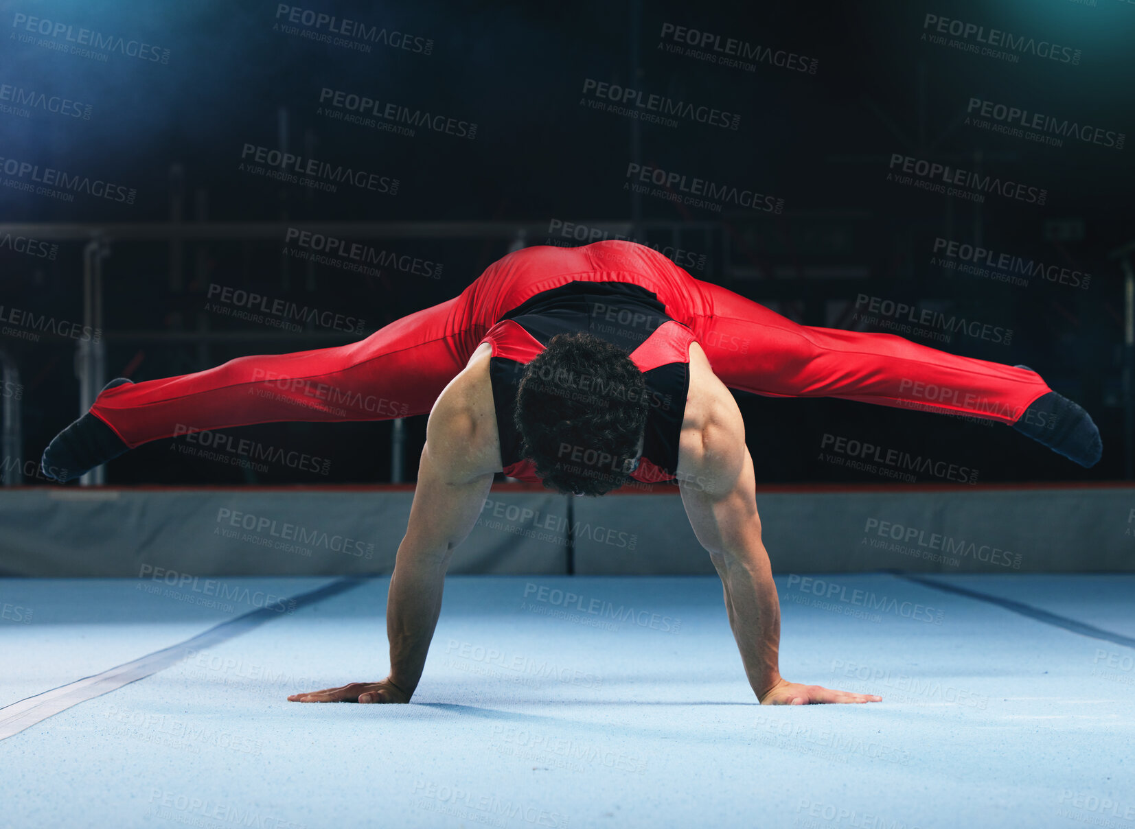 Buy stock photo Gymnastics, handstand and man on gym floor for training, balance and wellness with muscle, strong body and night. Gymnast, athlete and exercise in studio for competition, goals and fitness for sport