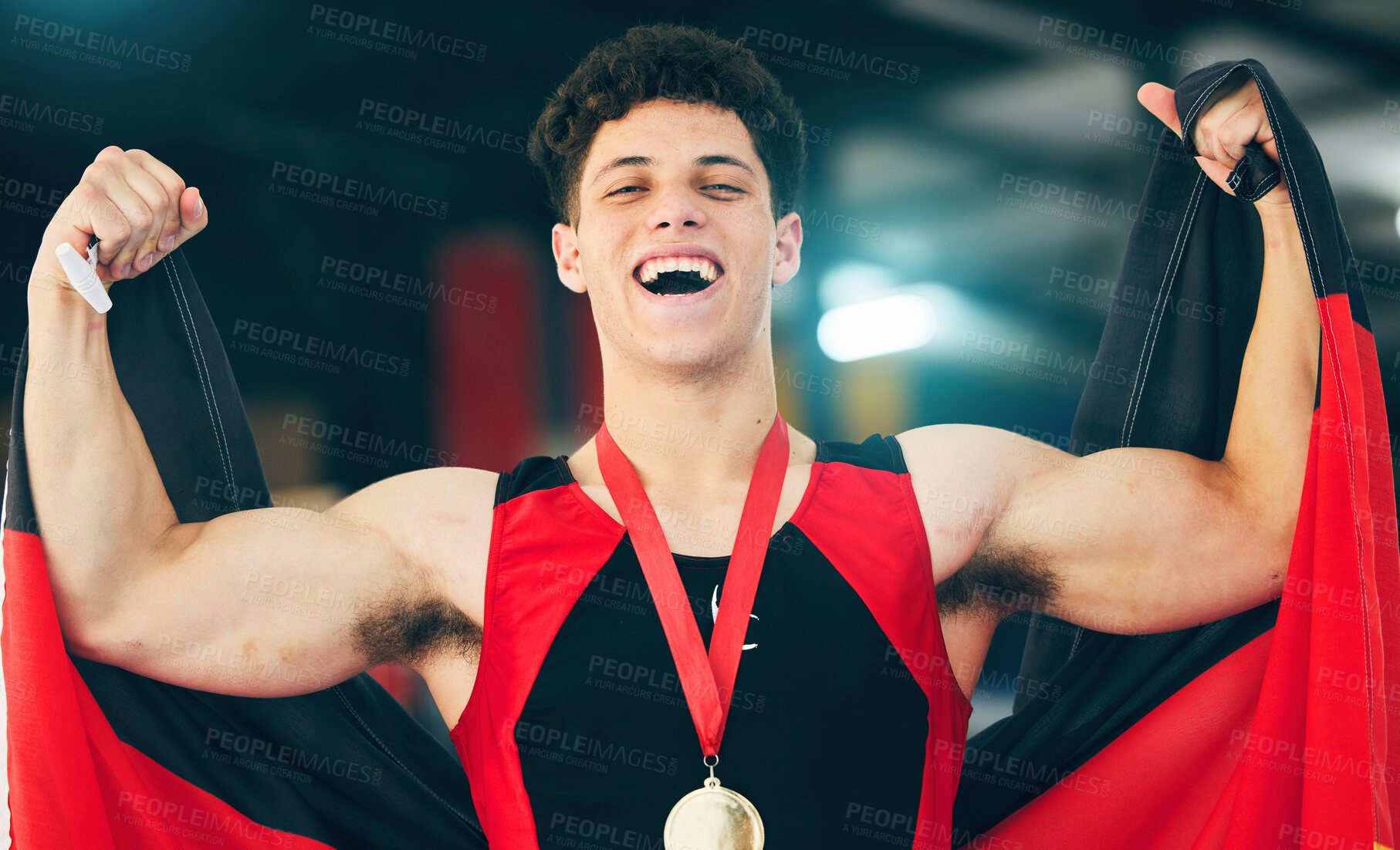 Buy stock photo Man, medal and flag for sport, portrait and winning with celebration, happiness or goal in competition. Gen z person, strong and winner with smile, celebrate and happy for victory in sports contest