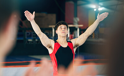 Buy stock photo Gymnastics, performance and celebration of man in stadium after stunt for health and wellness. Sports, exercise and workout, training or gymnast celebrate after performing at competition at night.