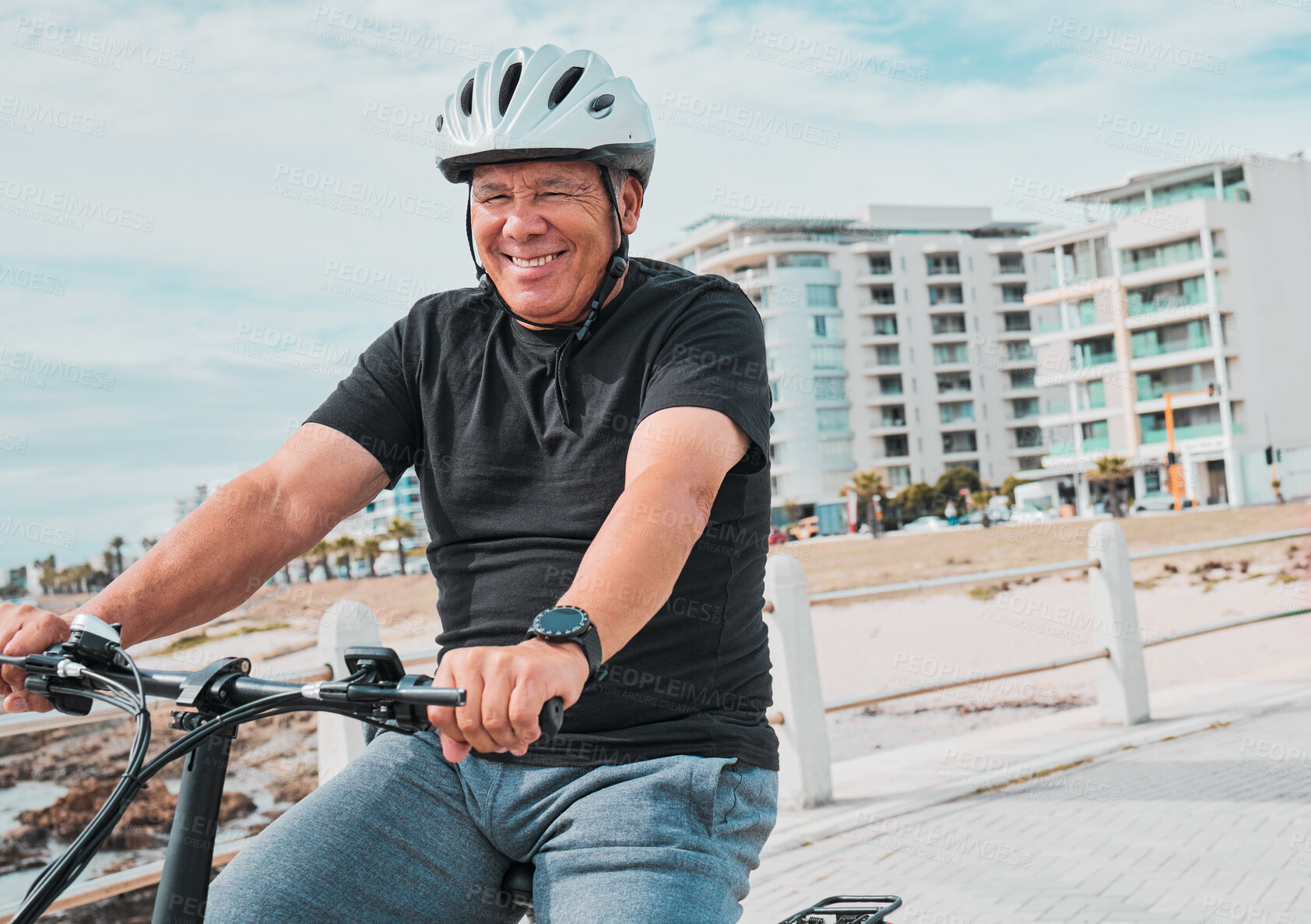 Buy stock photo Mature man, helmet or electrical bike by beach for future fitness, clean energy transport or sustainability travel. Happy person, technology or electric bicycle, head safety or eco friendly cycling