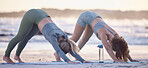 Woman, friends and yoga stretching on beach for spiritual wellness, zen or workout together in nature. Women yogi in warm up stretch, svanasana pose or pilates for healthy exercise on ocean coast