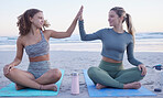 Woman, friends and high five in yoga on beach for spiritual wellness, zen or workout together in nature. Women yogi touching hands in success or achievement for pilates or healthy exercise by ocean