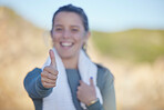 Thumbs up, exercise and a sports woman on a blurred background outdoor for a cardio or endurance workout. Hand sign, fitness and running with a femae athlete standing outside for health or wellness