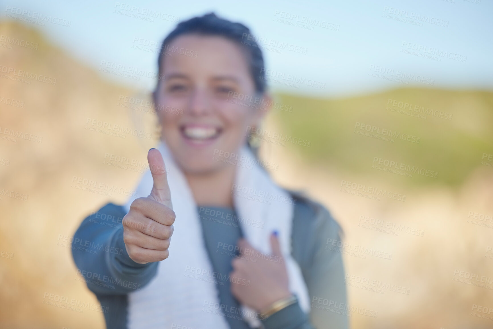 Buy stock photo Thumbs up, exercise and a sports woman on a blurred background outdoor for a cardio or endurance workout. Hand sign, fitness and running with a female athlete standing outside for health or wellness