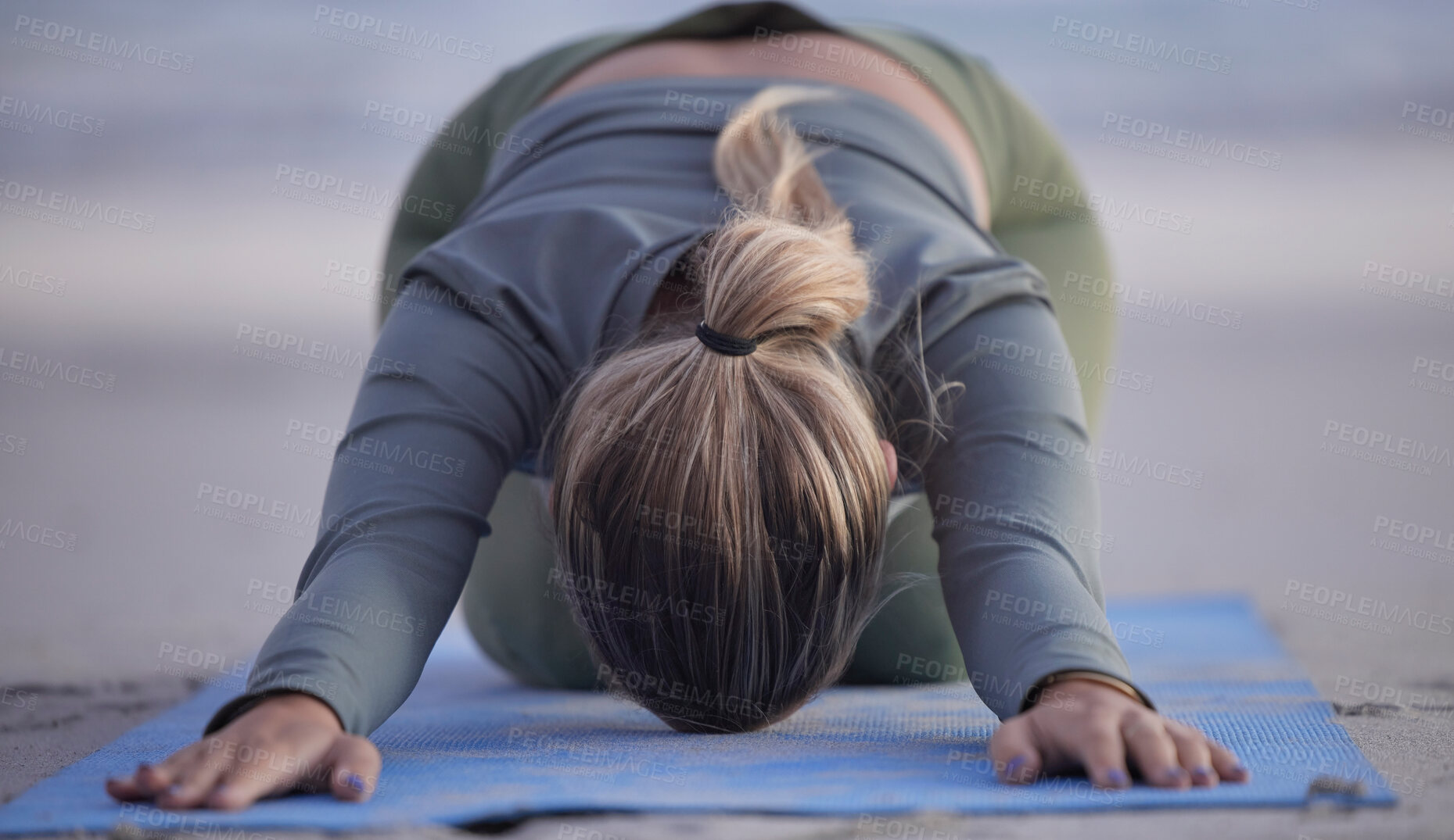 Buy stock photo Woman, yoga and stretching on beach for spiritual wellness, zen or workout in nature. Female yogi in warm up stretch, shishosana pose or pilates for healthy exercise or fitness by the ocean coast