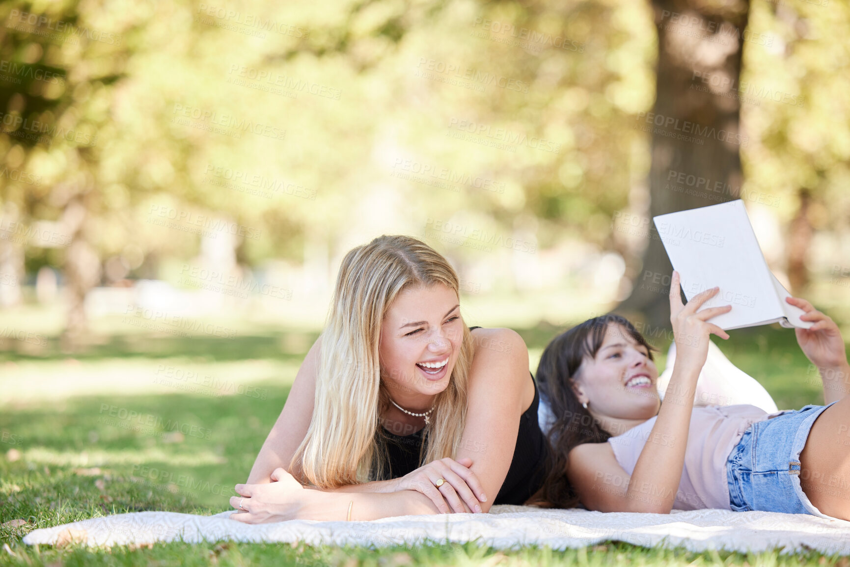 Buy stock photo Friends relax in the park, nature and reading with fun on a picnic, young women together with laughing and book. Summer, gen z and female students on vacation, fresh air for happiness and travel
