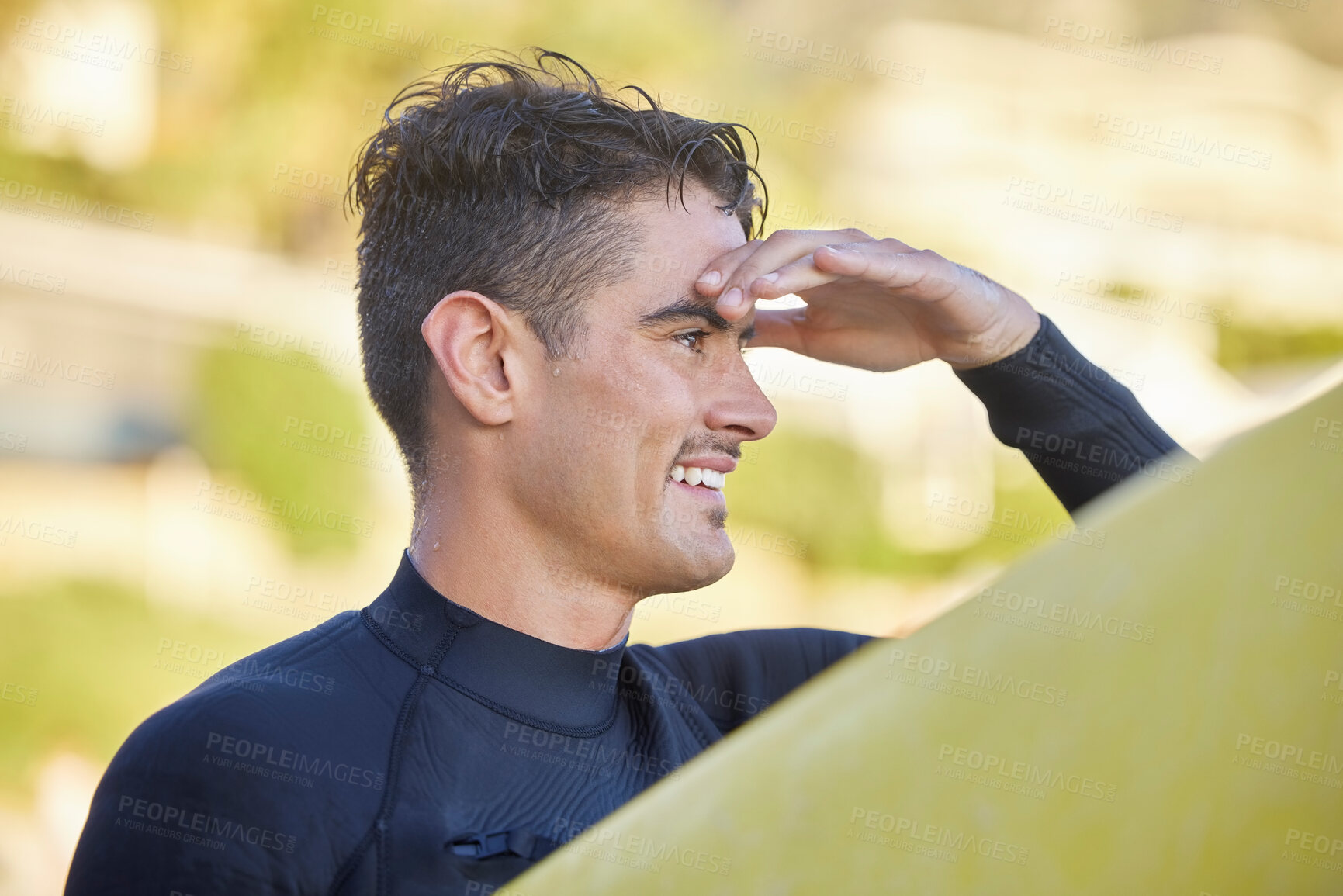 Buy stock photo Surfer man, beach and looking with smile for waves, excited and hand by eyes for safety in morning sunshine. Ocean athlete, surfboard or focus for fitness, sports and tropical adventure for workout