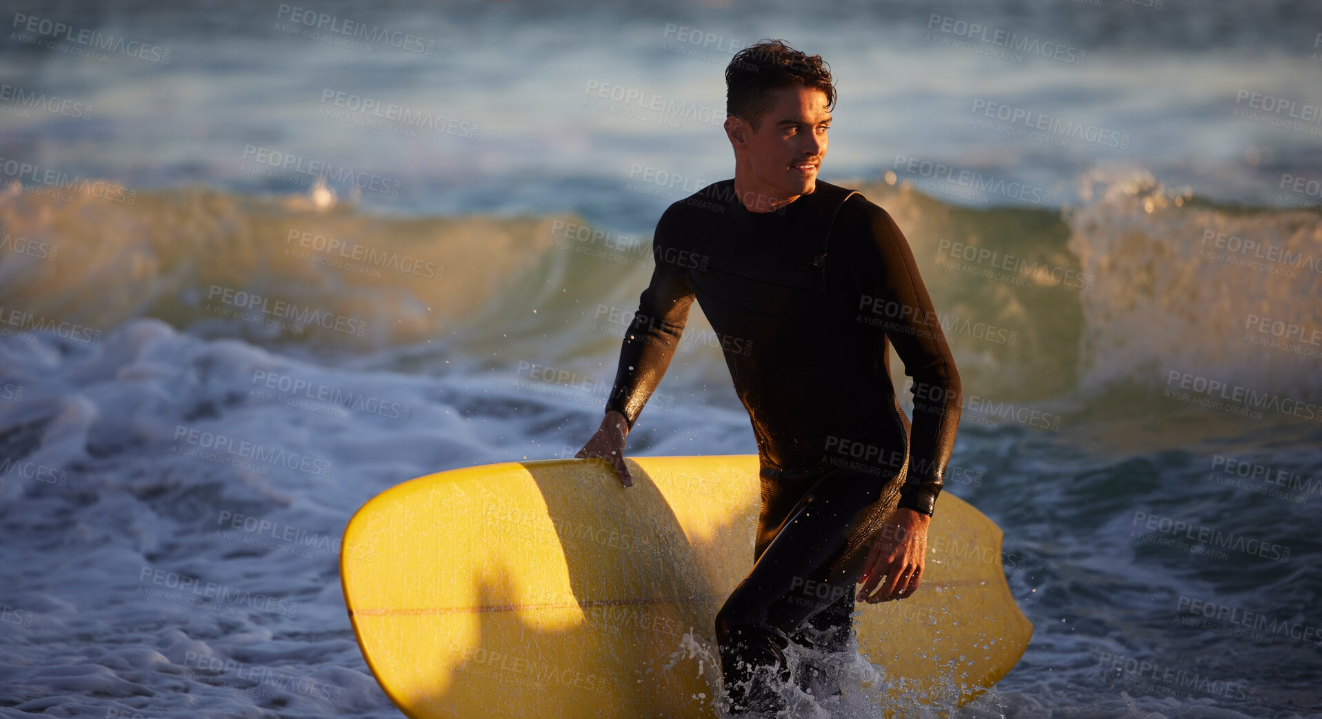 Buy stock photo Sea, sports and surfing with a man in the water by the beach for fitness or training for a competition. Ocean, wetsuit and surfboard with a male athlete outdoor for an exercise or workout routine