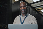 Laptop, portrait and IT black man in server room for research, engineer working in dark data center lobby. Face, cybersecurity or analytics with male programmer problem solving or troubleshooting