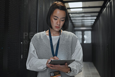 Buy stock photo Tablet, server room and networking with a programmer asian woman at work on a computer mainframe. Software, database and information technology with a female coder working alone on a cyber network