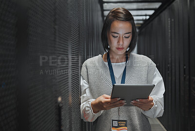 Buy stock photo Tablet, server room and cloud computing with a programmer asian woman at work on a mainframe. Software, database and information technology with a female coder working alone on a cyber network