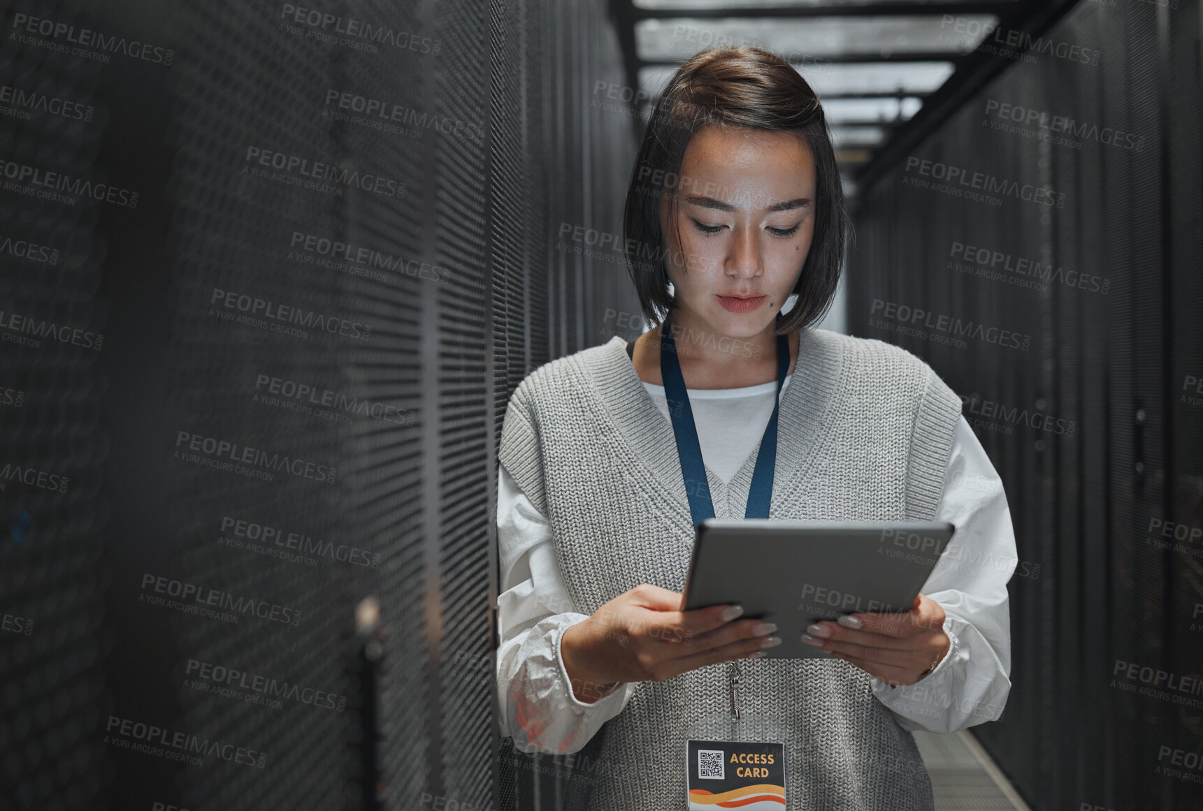 Buy stock photo Tablet, server room and cloud computing with a programmer asian woman at work on a mainframe. Software, database and information technology with a female coder working alone on a cyber network