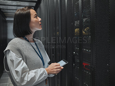 Buy stock photo Tablet, server room and big data with a programmer asian woman at work on a computer mainframe. Software, database and information technology with a female coder working alone on a cyber network