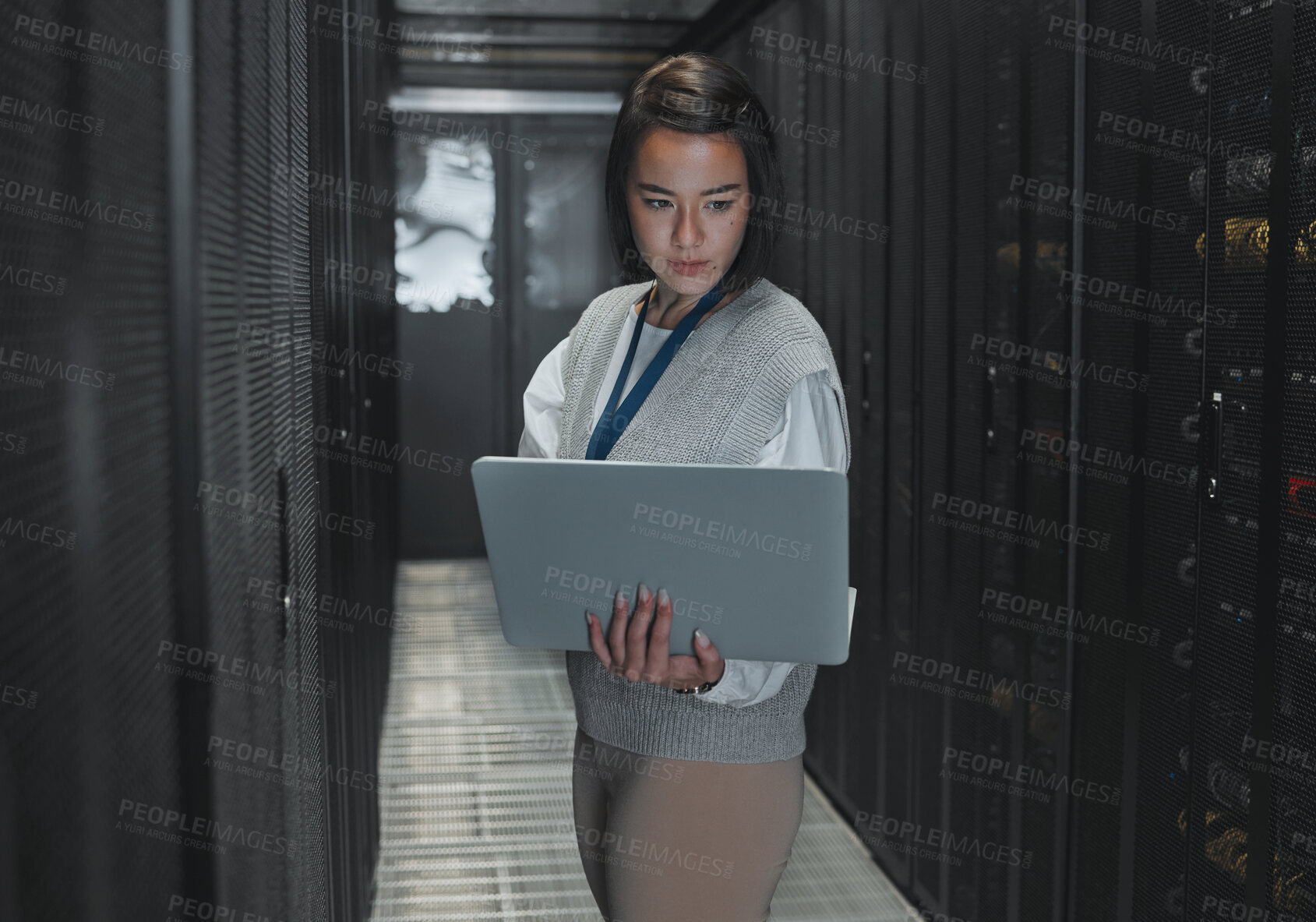 Buy stock photo Woman with laptop, server room and IT, engineer and datacenter with software update and programming. Tech industry, cybersecurity and network with Asian female setting up firewall and database
