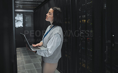 Buy stock photo Server room, laptop and young woman or technician in data center management, system and cyber security. Thinking, serious and inspection of asian electrician, engineer or programmer person code check